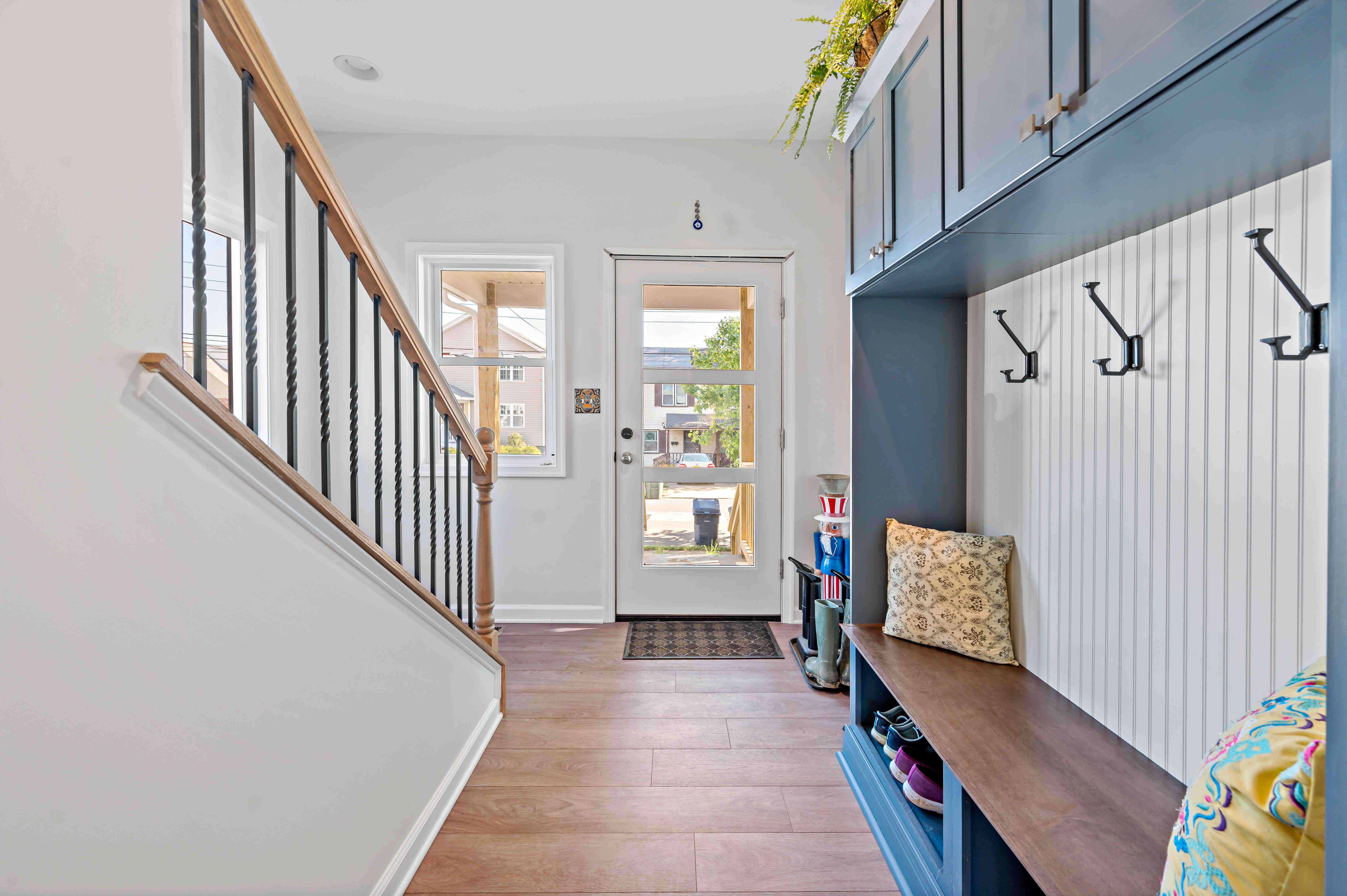 Blue mudroom in entryway of home