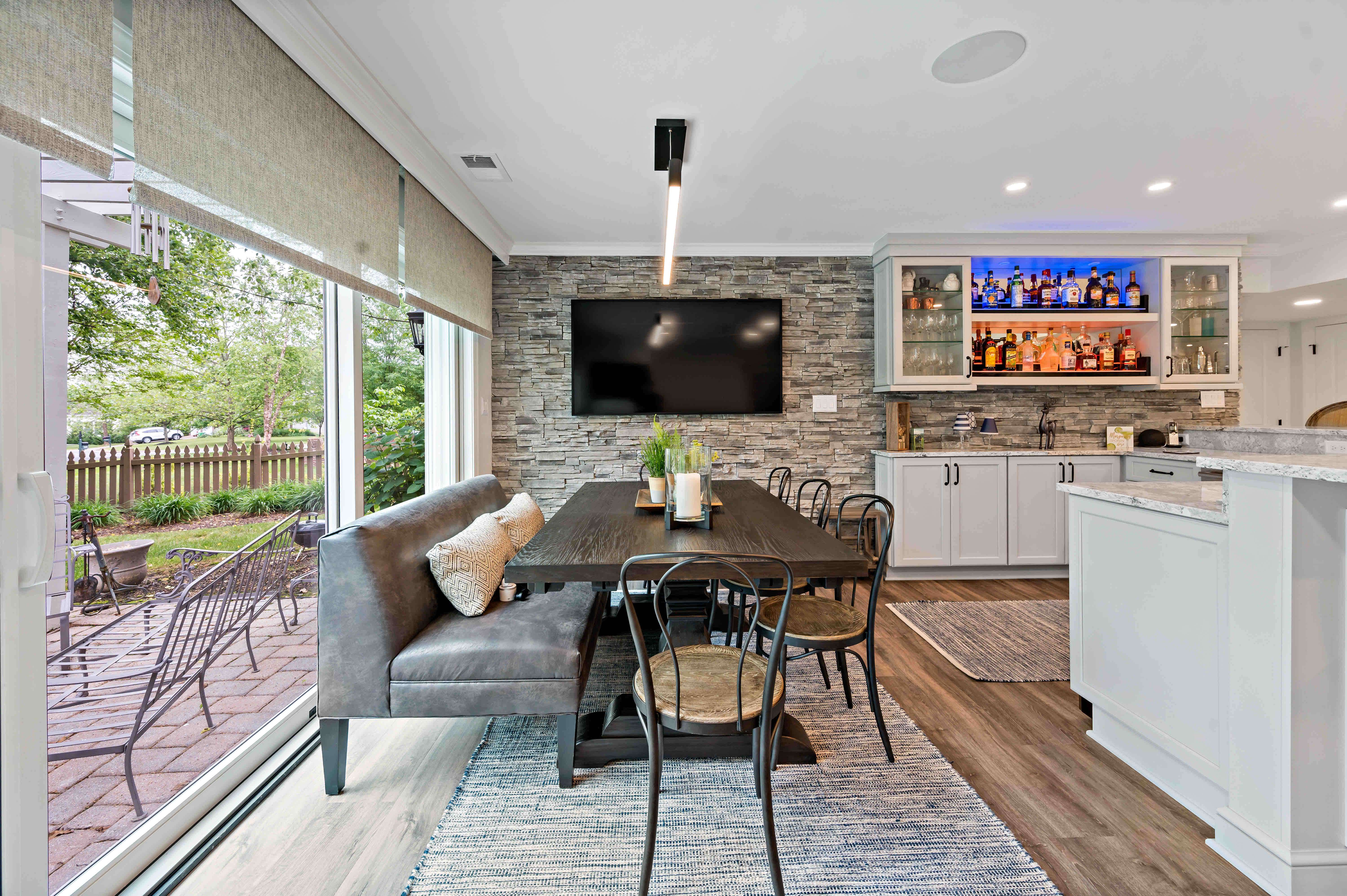Basement kitchen and dining room area with backyard view and access