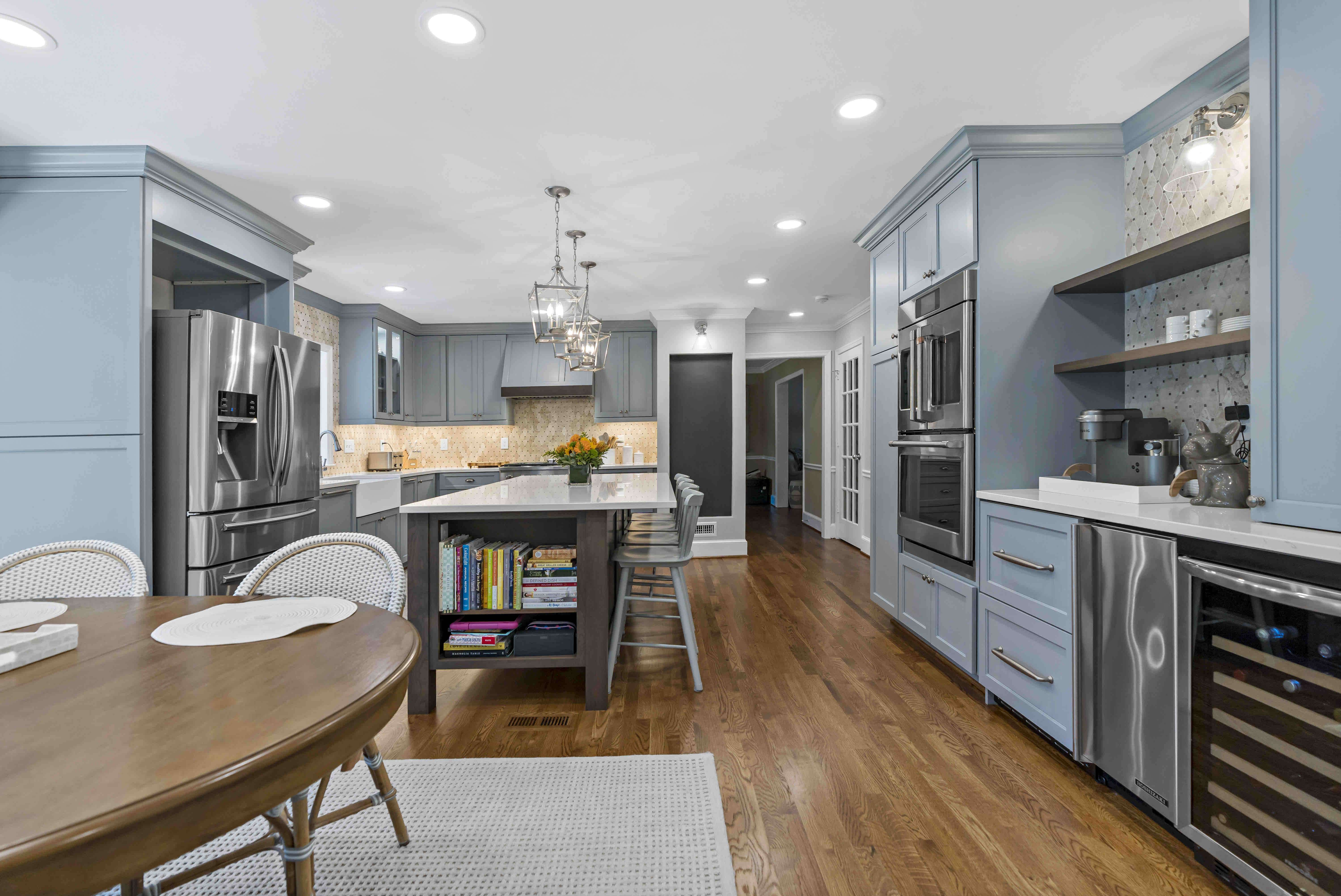 Light blue and brown, rustic kitchen with coffee bar and island