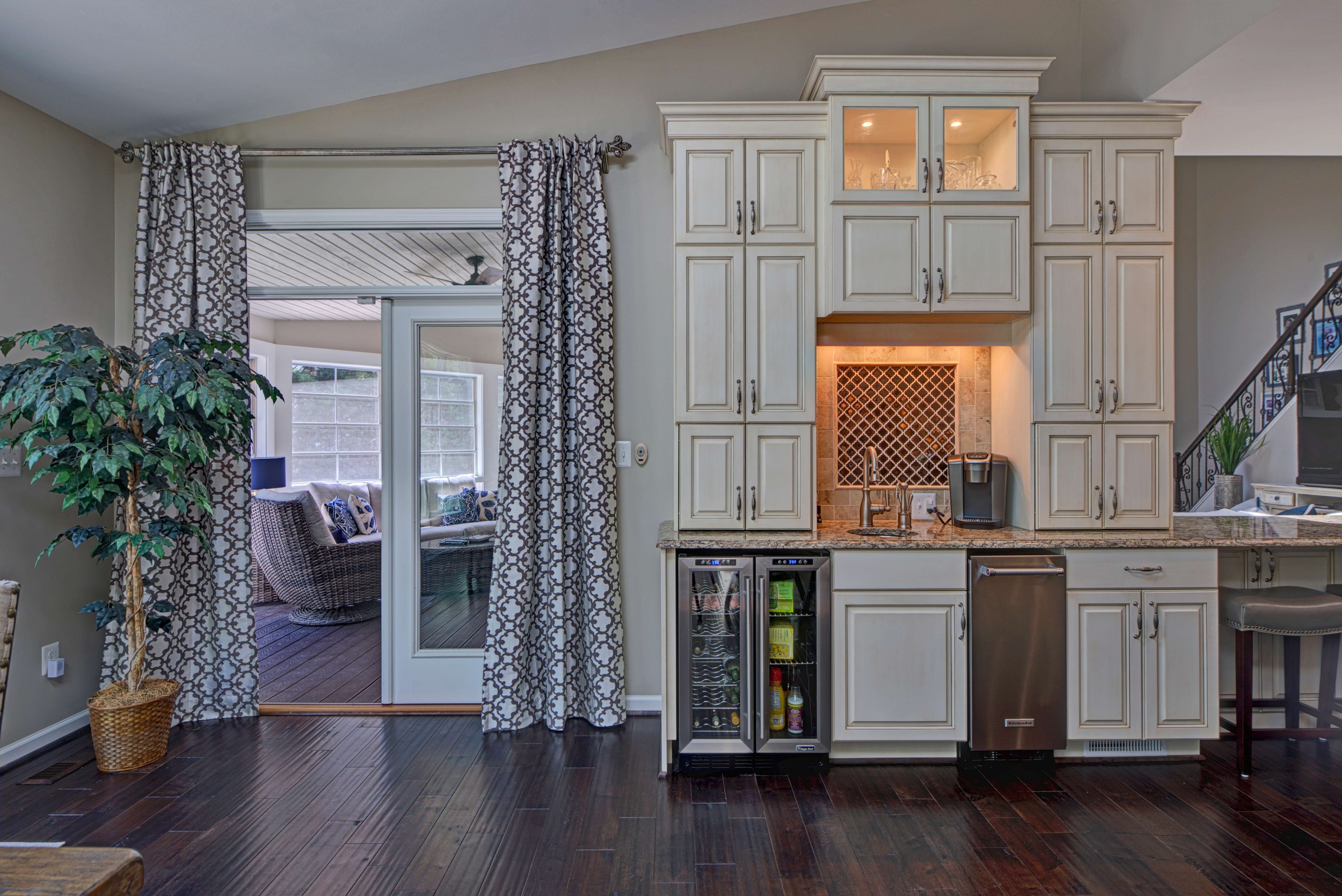 Kitchen cabinet storage leading to backyard porch