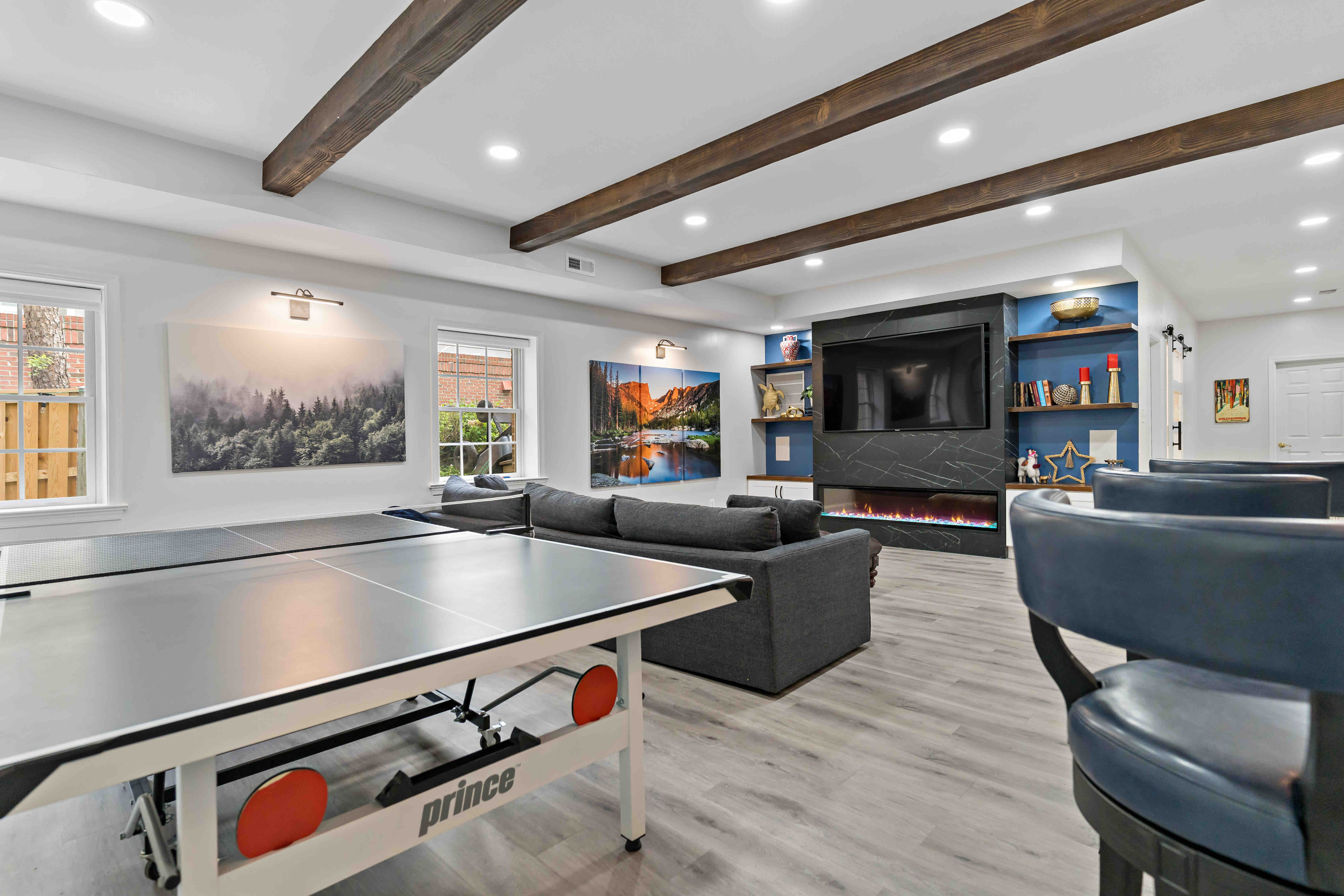 Built-in shelves and electric fireplace in entertainment center for basement