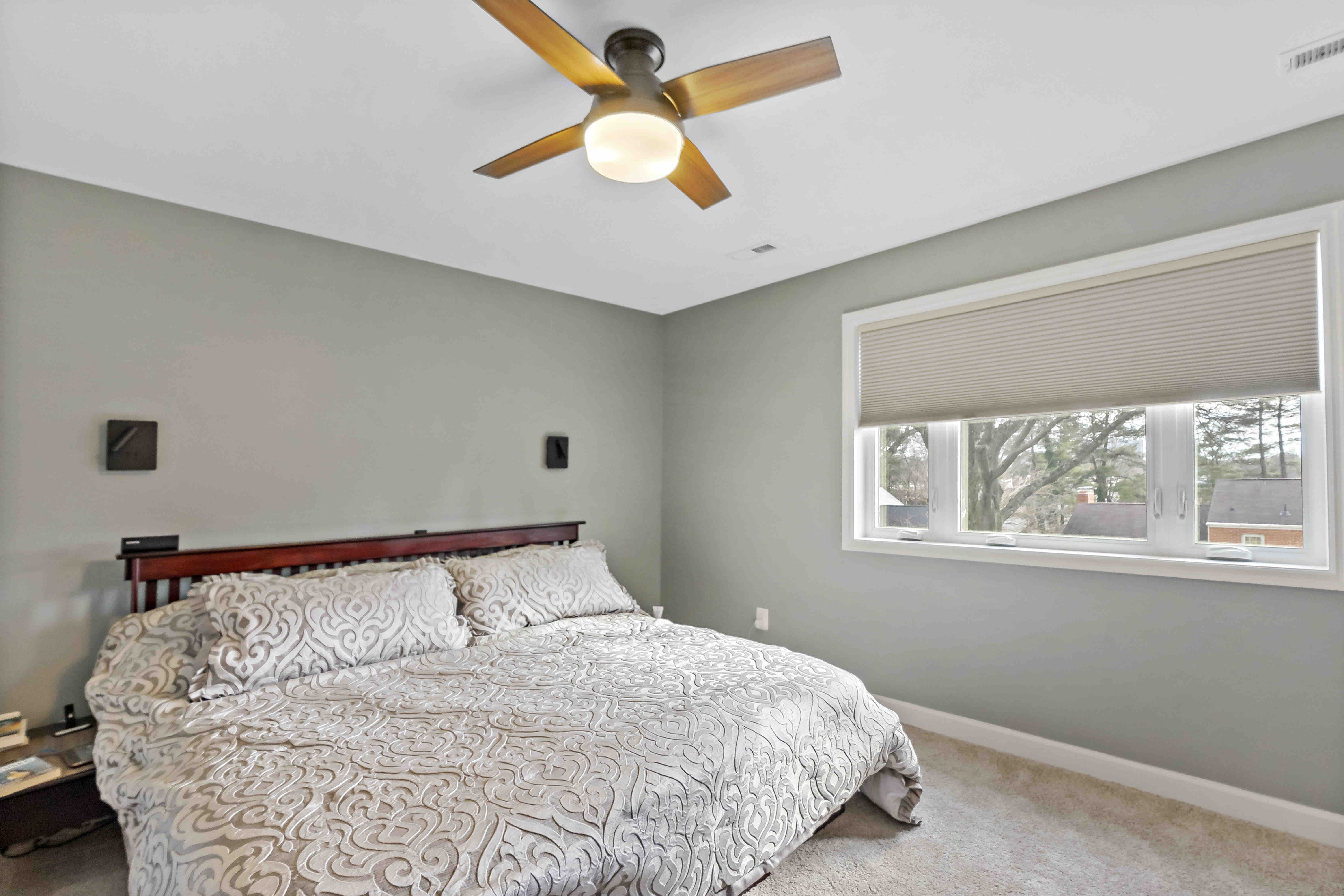 Carpeted bedroom with king size bed